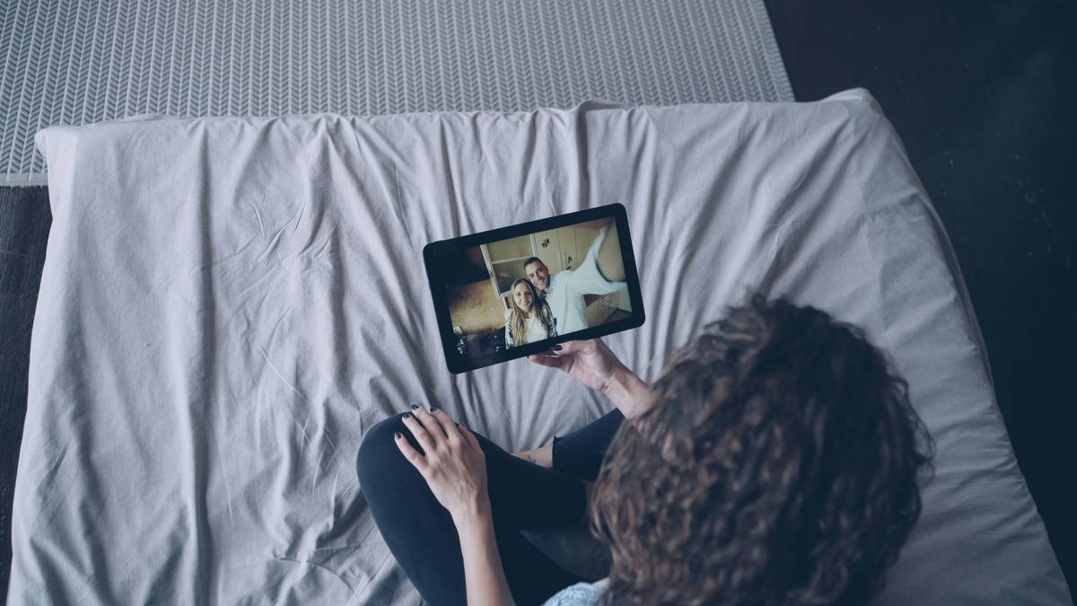 woman checking free trial streaming service expiry on smartphone calendar